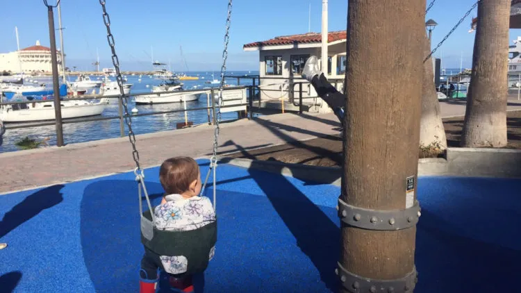 Enjoying-the-View-750×422 a boy sitting at a dock