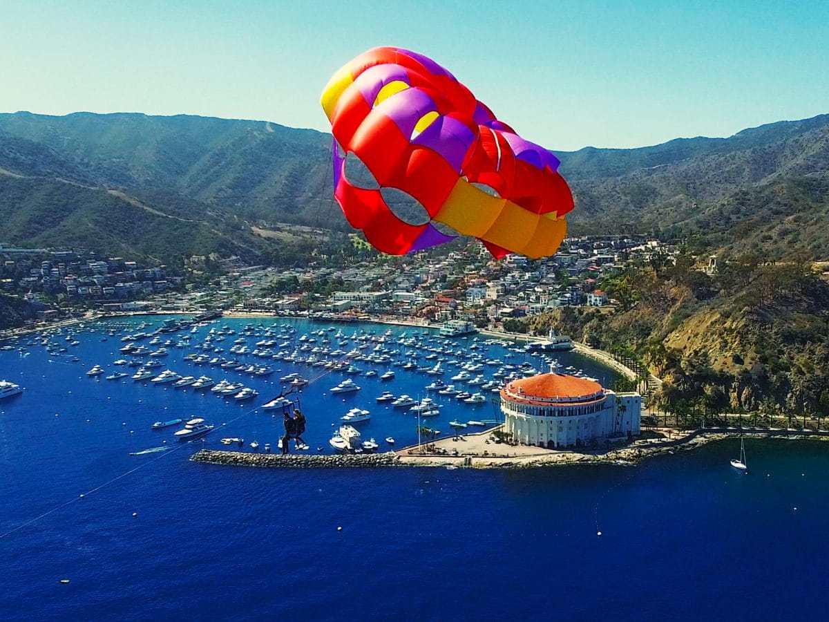 a parachute is sitting next to a body of water