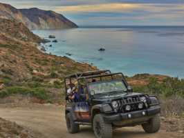 a car parked on the side of a mountain