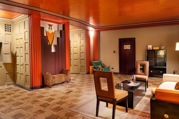 a living room filled with furniture and a fireplace