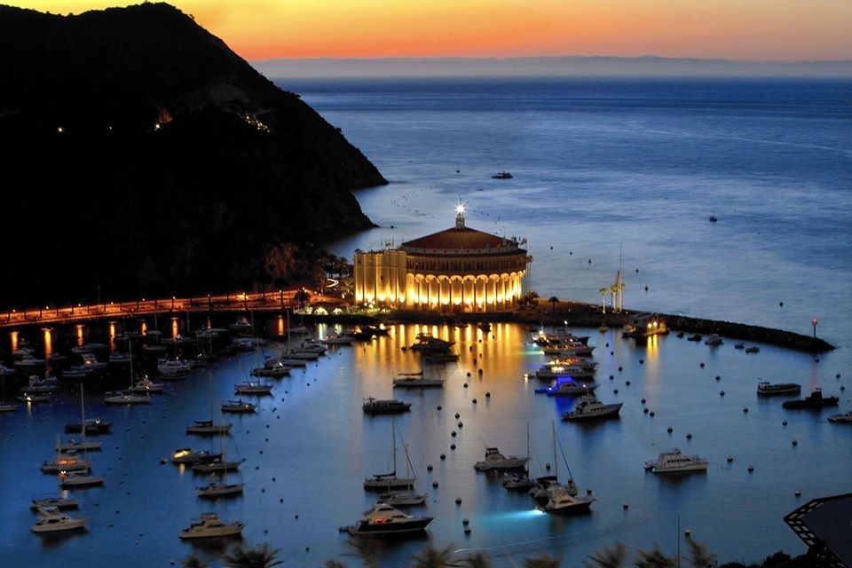 a boat is docked next to a body of water