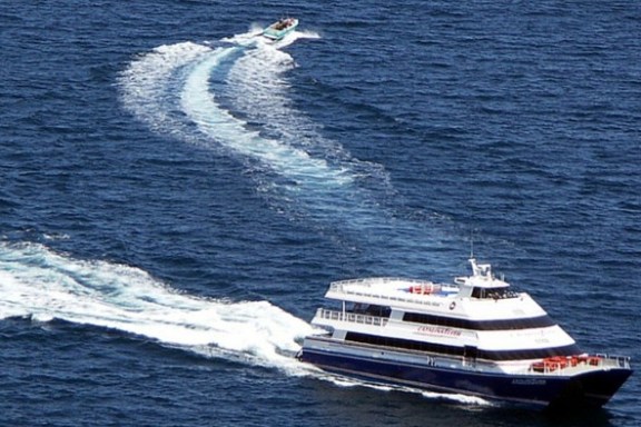 a small boat in a large body of water