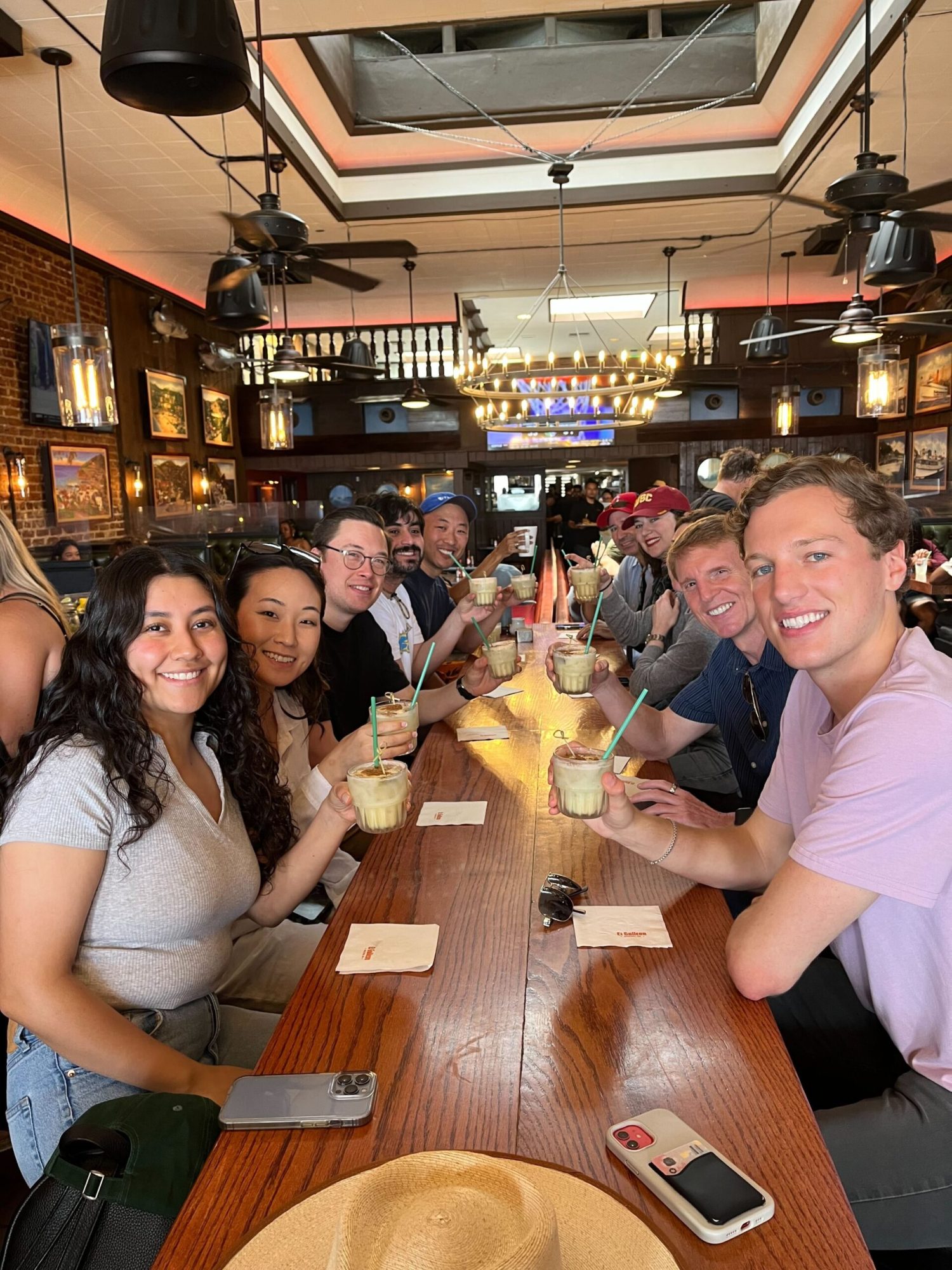 Cheers from El Galleon a group of people sitting at a table enjoying a cocktail at El Galleon