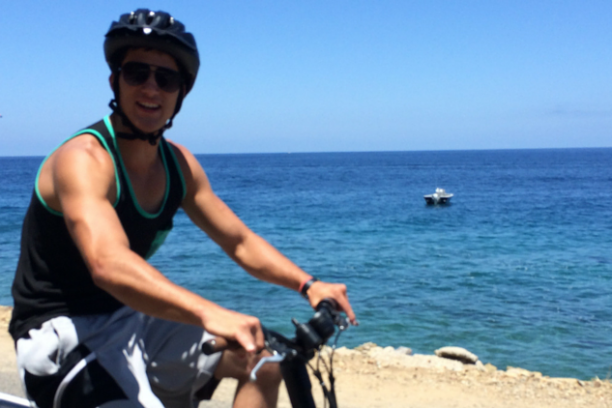 a person standing next to a body of water