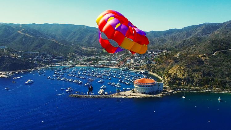 a parachute with a body of water