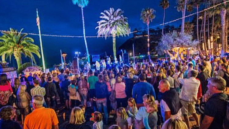 a group of people standing in front of a crowd