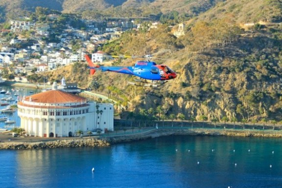 a large body of water with a mountain in the background