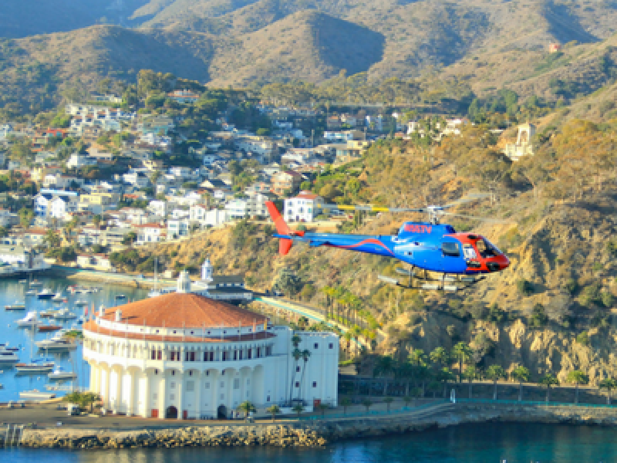a body of water with a mountain in the background