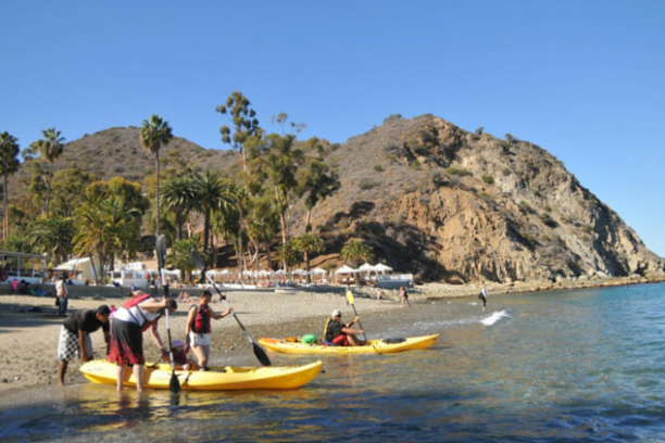 a group of people on a boat in the water