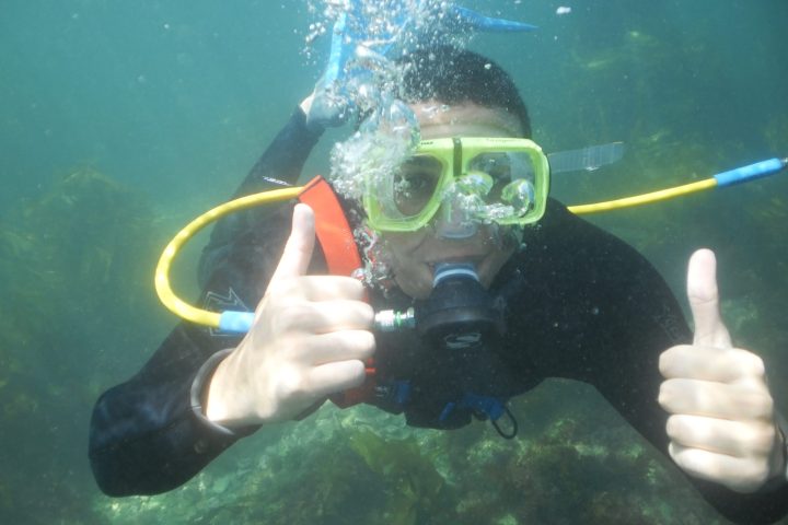a person holding a glass of water