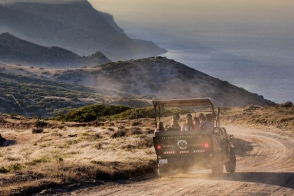 a truck driving down a dirt road