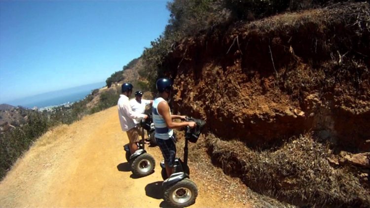 Segway-Off-Road-Adventure-750×422 a man riding a skateboard up the side of a hill