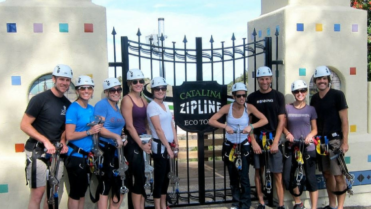 The-Catalina-Island-Zip-Line-Eco-Tour-is-great-for-small-group-visit-Avalon-750×422 a group of people posing for the camera