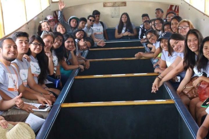 a group of students sitting on a glass bottom boat in Catalina