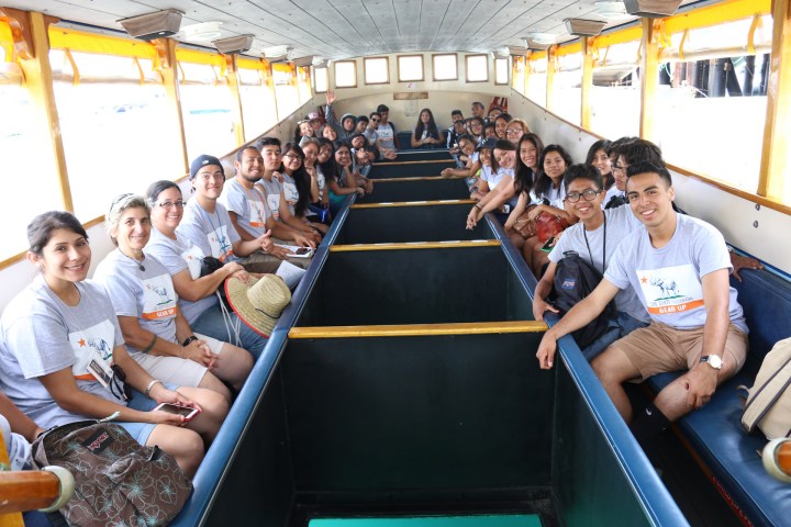 a group of people sitting at a train station