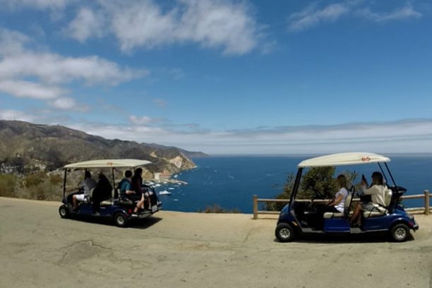 a group of people riding on the back of a truck