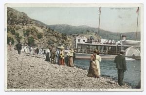 a group of people standing in front of a mountain