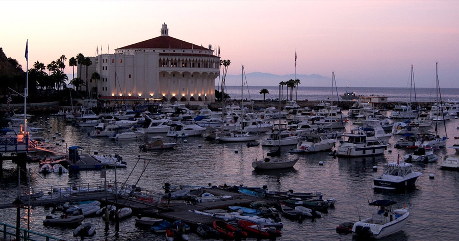 Casino Building a boat is docked next to a body of water