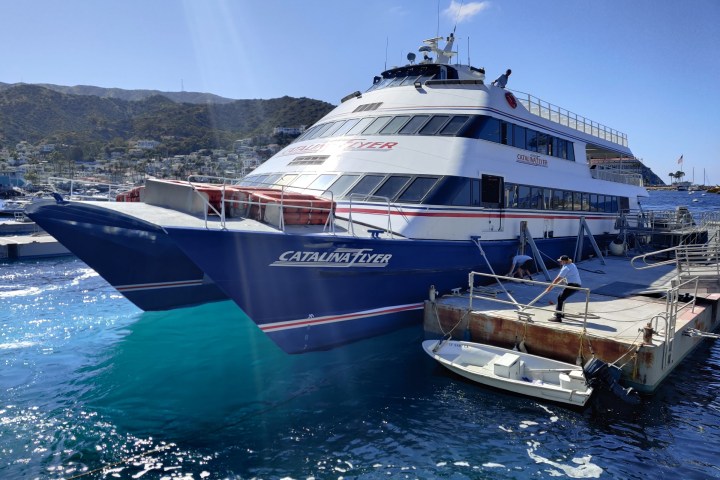 a boat is docked next to a body of water