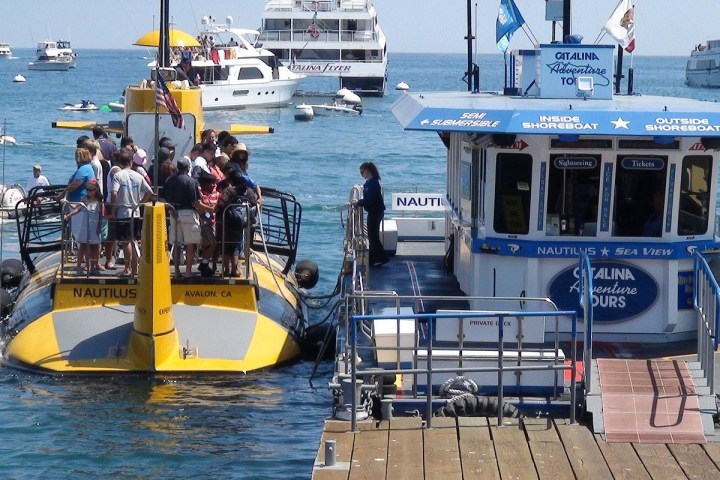 a boat is docked next to a body of water